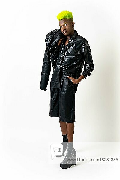 Black ethnic man in studio with white background  LGTBI concept  leather jacket