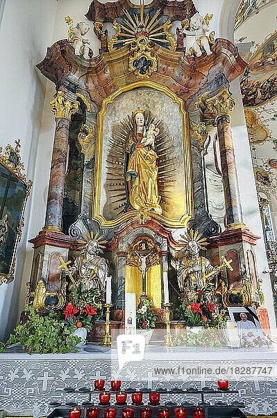 Side altar with offering candles  Church of St. Peter and Paul  Bad Petersthal  Allgäu  Bavaria  Germany  Europe