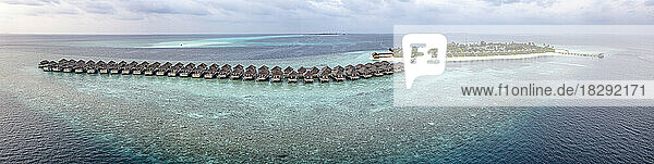 Resort with water bungalows on turquoise Indian ocean  Maldives