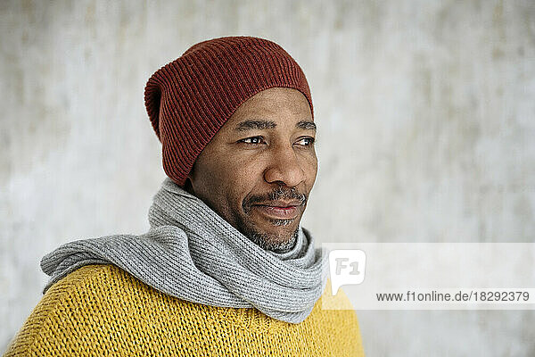 Mature man wearing scarf and knit hat