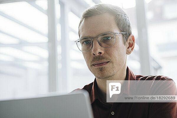 Businessman working on laptop at office