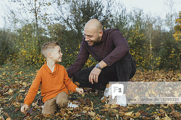 Happy father with son enjoying in autumn