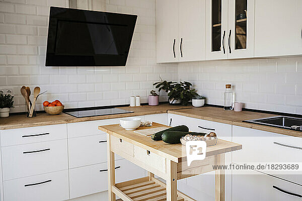 Modern kitchen with vegetables kept on table at home