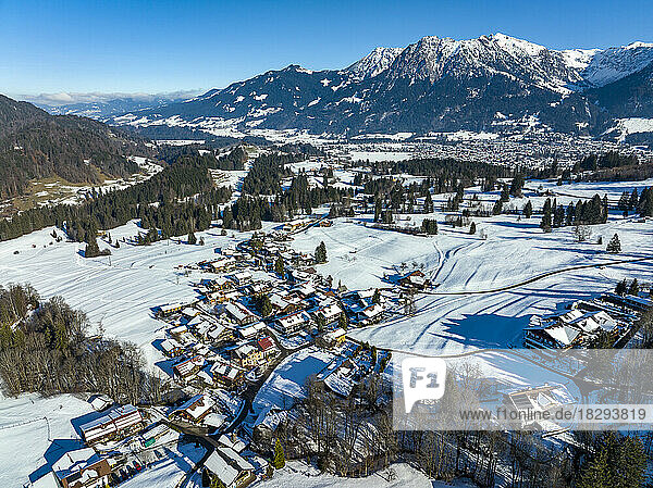 Germany  Bavaria  Oberstdorf  Aerial view of snow-covered town in Allgau Alps