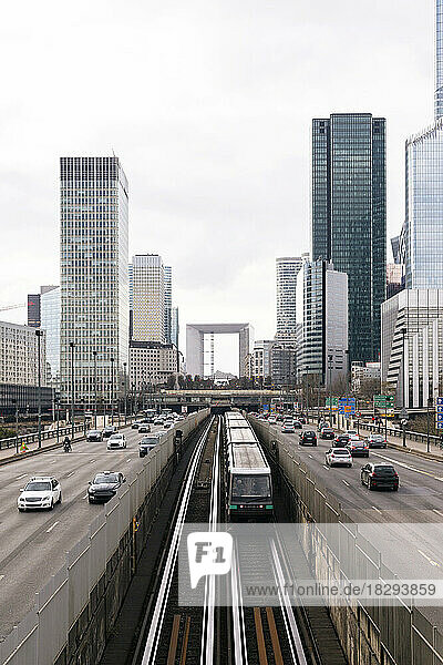 France  Ile-de-France  Paris  City traffic with skyscrapers of La Defense district in background