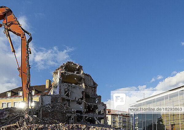 Germany  Bavaria  Munich  Construction vehicle demolishing building