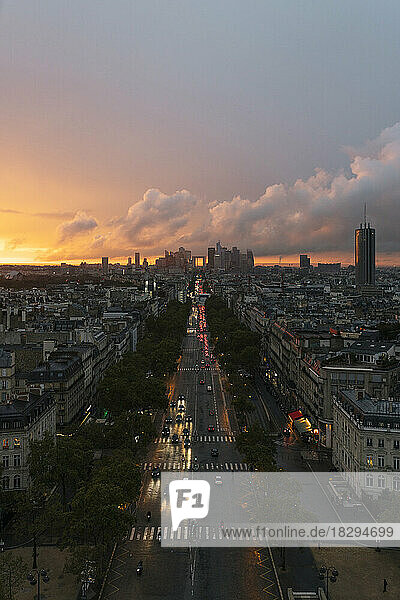 France  Ile-de-France  Paris  Traffic along city street seen from top of Arc de Triomphe at sunset