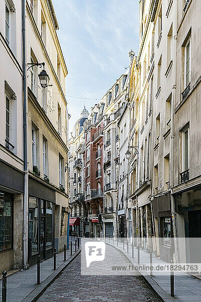 France  Ile-de-France  Paris  Narrow street stretching between rows of residential buildings