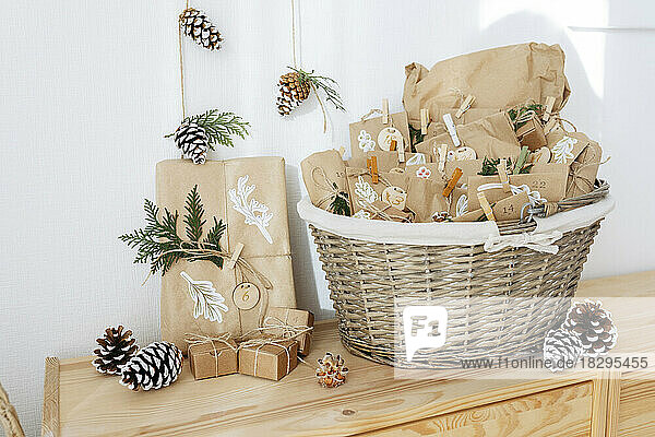 Decorated paper bags for DIY advent calendar and kept in basket