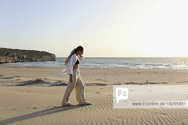 Young woman walking on sand at beach  Patara  Turkiye