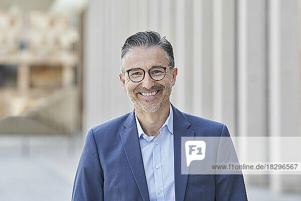 Happy mature businessman wearing eyeglasses