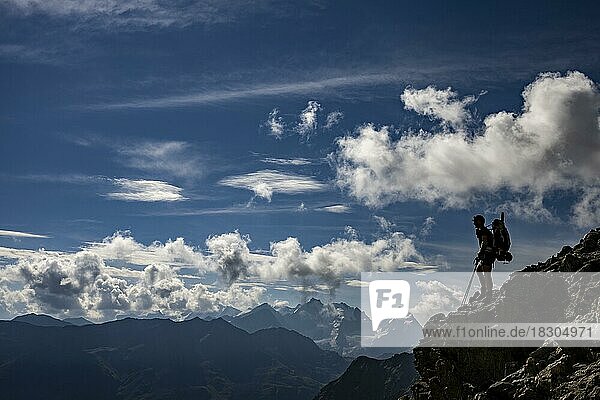 Bernina Group with Mountaineers and Engadine Mountains with Cloudy Sky  St Moritz  Engadine  Grisons  Switzerland  Europe