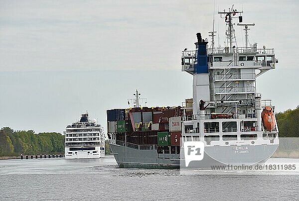 Cruise ship Hanseatic Inspiration and container ship on voyage through the Kiel Canal  Schleswig-Holstein  Germany  Europe