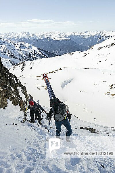 Ski tourers on the ascent in a saddle  mountains in winter  Kühtai  Tyrol  Austria  Europe