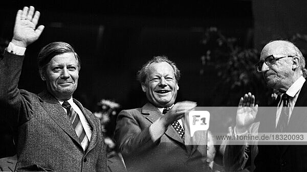 An election rally of the Social Democratic Party of Germany (SPD) on 23.4.1975 in Dortmund's Westfalenhalle.Helmut Schmidt  Willy Brandt  Heinz Kuehn from left  Germany  Europe