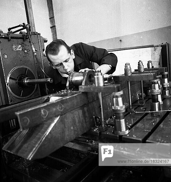 Older workers are retrained in metal trades as locksmiths and lathe operators in the Krupp AG workshops in Bochum in 1967  Germany  Europe