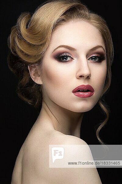 Portrait of a beautiful woman in the image of the bride. Picture taken in the studio on a black background