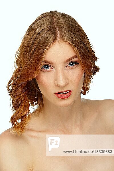 Face of beautiful young woman with blue eyes and red lips. Beauty portrait  fresh skin. Natural makeup