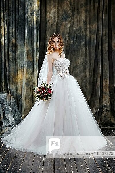 Full length portrait of pretty bride in wedding dress