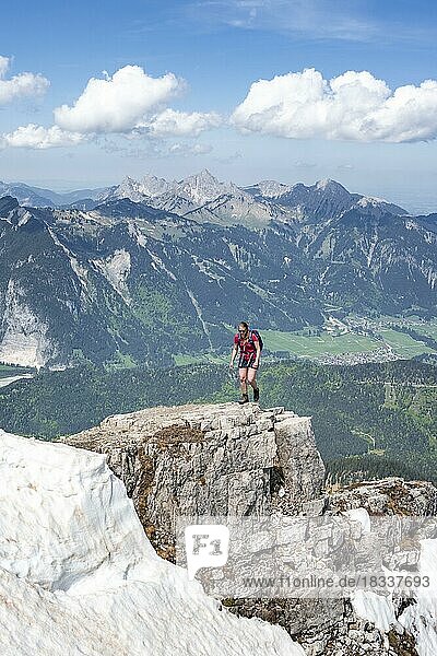 Hiker at a rock edge  view from Thaneller  eastern Lechtal Alps  Tyrol  Austria  Europe