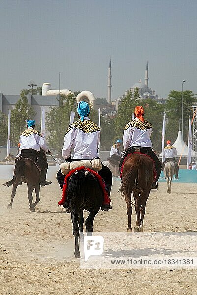 Horseman riding in their ethnic clothes on horseback