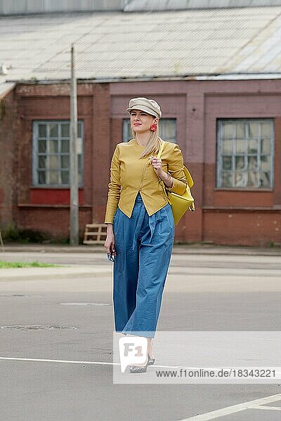 Lady walking at industrial area