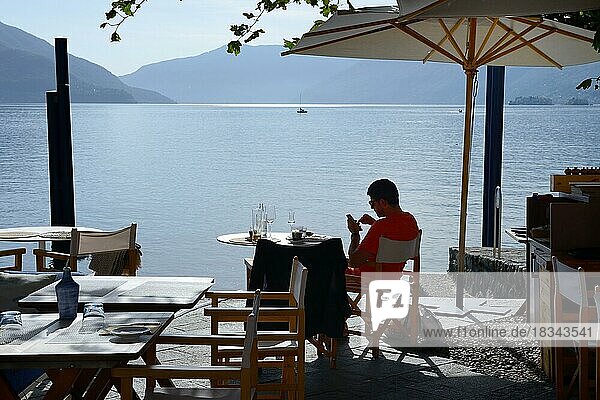 Restaurant on the lake promenade with a view of Lake Maggiore  Ascona  Canton Ticino  Switzerland  Europe