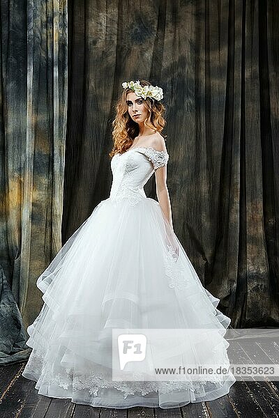 Full length portrait of pretty bride in wedding dress