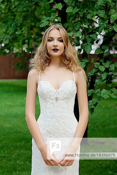 Outdoor portrait of a beautiful fashion bride  sweet and sensual. Wedding make up and hair