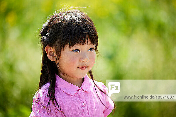Japanese kid portrait in a city park