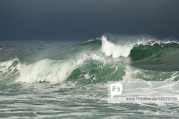 Big waves crashing in the open sea and dramatic light off the north coast of Ireland  Fintra Beach in County Donegal