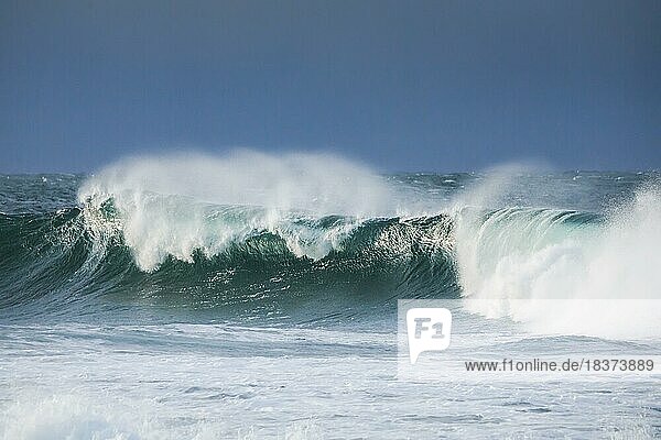 Big wave breaks in the open sea on the Breton coast near Brest  France  Europe