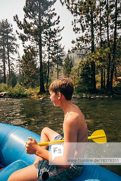 USA  California  Boy (12-13) rafting on Truckee river