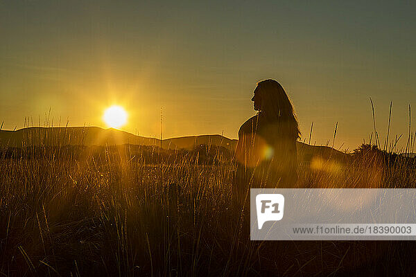 sunset silhouette view of woman in field near Sun Valley Idaho