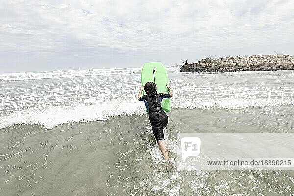 young body boarder Voelklip beach Hermanus South Africa