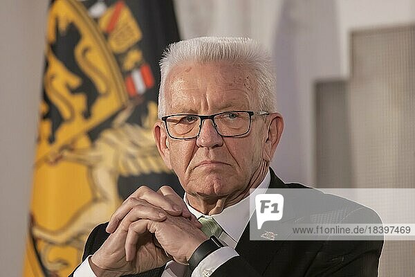 Winfried Kretschmann  party Die Grüne  Minister President BW  portrait in front of a flag with the coat of arms of Baden-Württemberg  Stuttgart  Baden-Württemberg  Germany  Europe