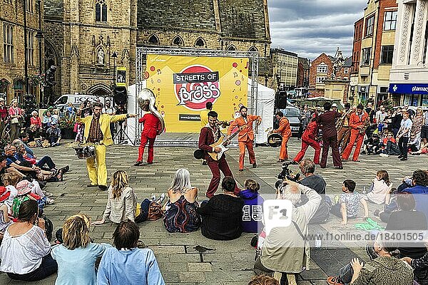 Street musicians and passers-by  band at the Brass International Festival in the summer  music festival in Durham  England  Great Britain