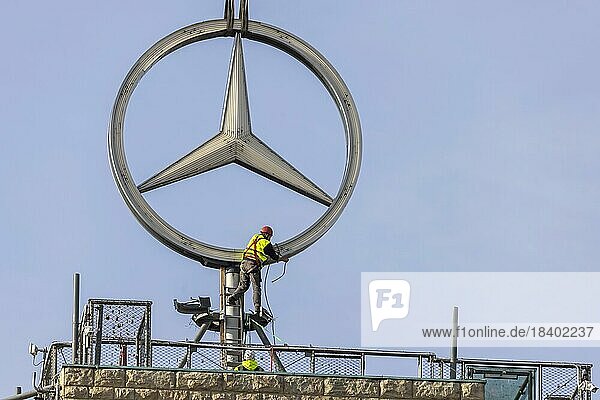 Mercedes star on the station tower is being dismantled. During the approximately 250 million euro refurbishment of the Bonatzbau  the star temporarily moves in front of the Mercedes Museum in Bad Cannstatt  Stuttgart  Baden-Württemberg