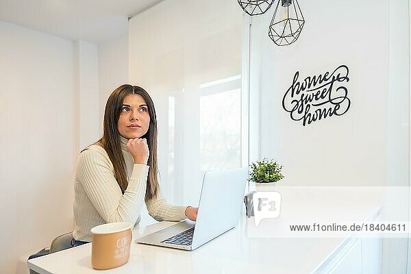 Businesswoman working with a computer pensive  business  home office  telecommuting