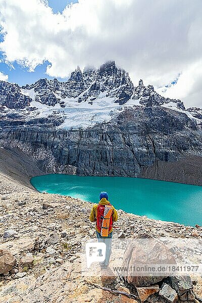 Hiker standing at the lagoon  glacial lake at Cerro Castillo mountain  Cerro Castillo National Park  Aysen  Patagonia  Chile  South America