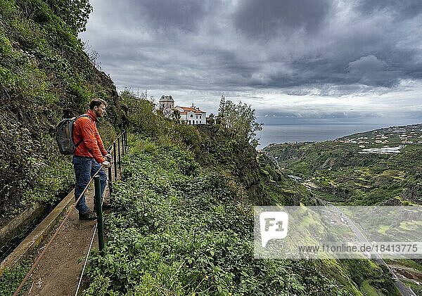 Hiker on footpath  Levada do Moinho  Ponta do Sol  Madeira  Portugal  Europe