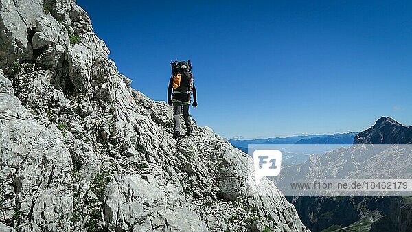 Tourist with equipment on the via ferrata trail in the alps. Zugspitze massif  Bavarian Alps  Bavarian Alps  Germany  Europe