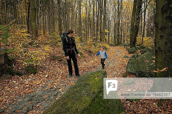 Mum and child are walking along the mountain hiking trail. Family spending time. Polish mountains  Poland  Europe