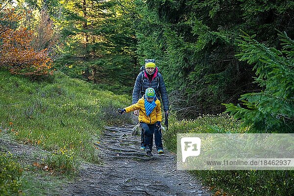Mum and child are walking along the mountain hiking trail. Family spending time. Polish mountains  Poland  Europe