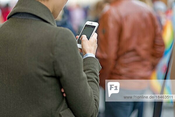 Woman communicating with her mobile phone