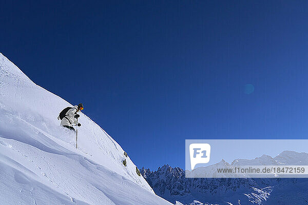 Woman skiing down on slopes