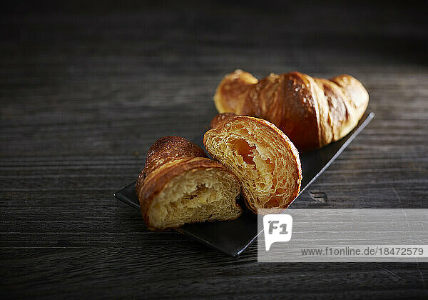 Studio shot of tray with fresh croissants