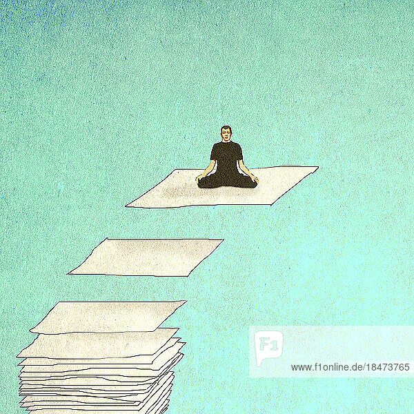 Mann meditiert auf schwebendem Blatt Papier