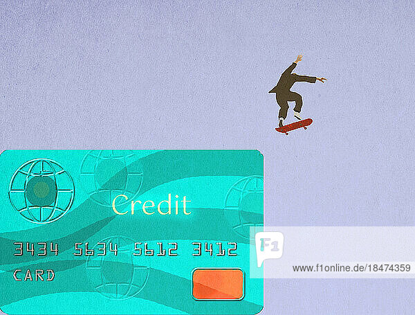 Businessman skateboarding off oversized credit card