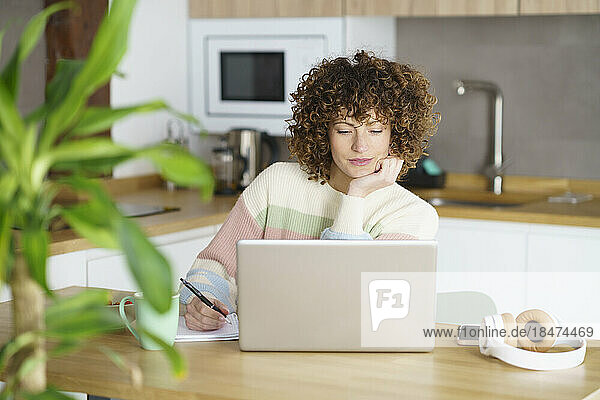 Freelancer working on laptop at home